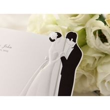 Embossed bride and groom invitation detail; cropped